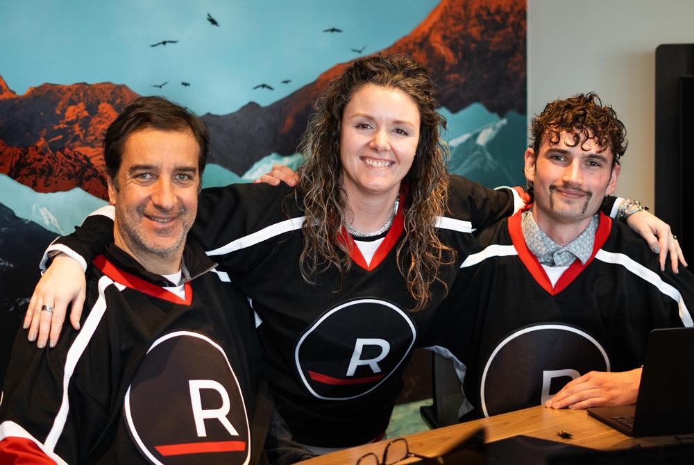 Three Redline agents in team jerseys at awards night