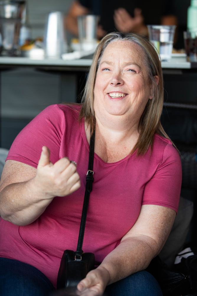 An agent giving a thumbs up at the golf day