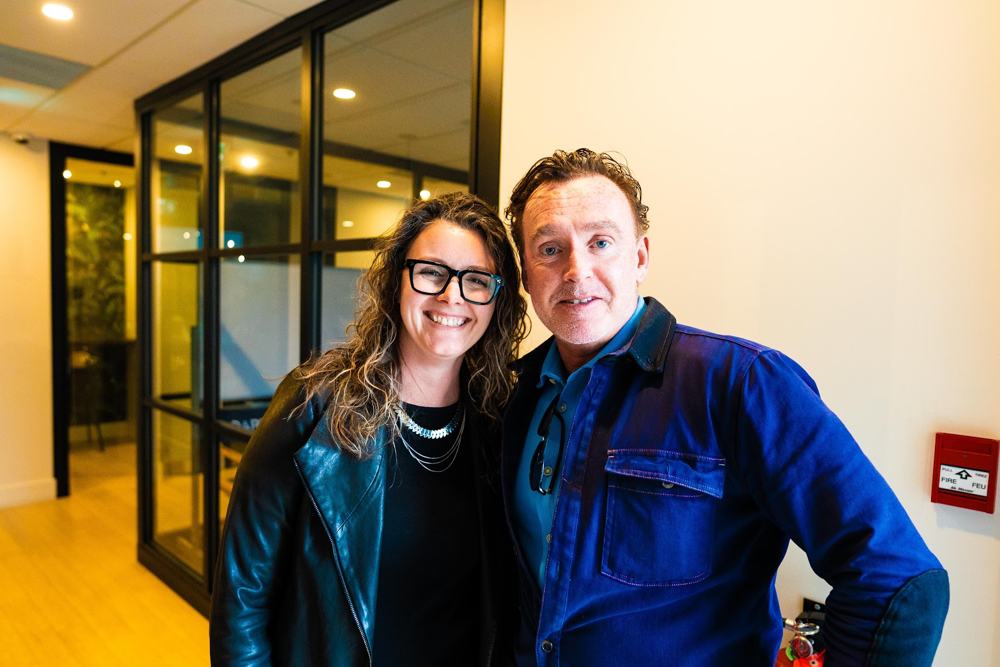Two agents smiling together at Redline HQ